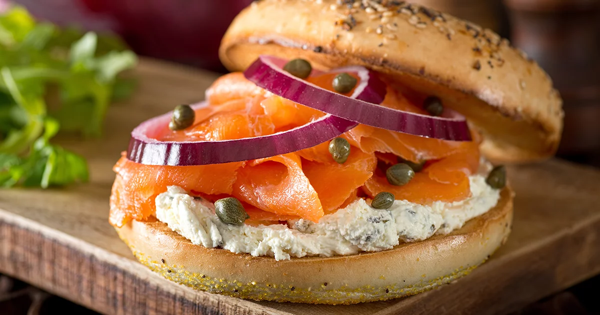 https://aquabounty.com/our-salmon/recipes/image-thumb__115__social_share/smoked-salmon-sandwich-with-cream-cheese.webp